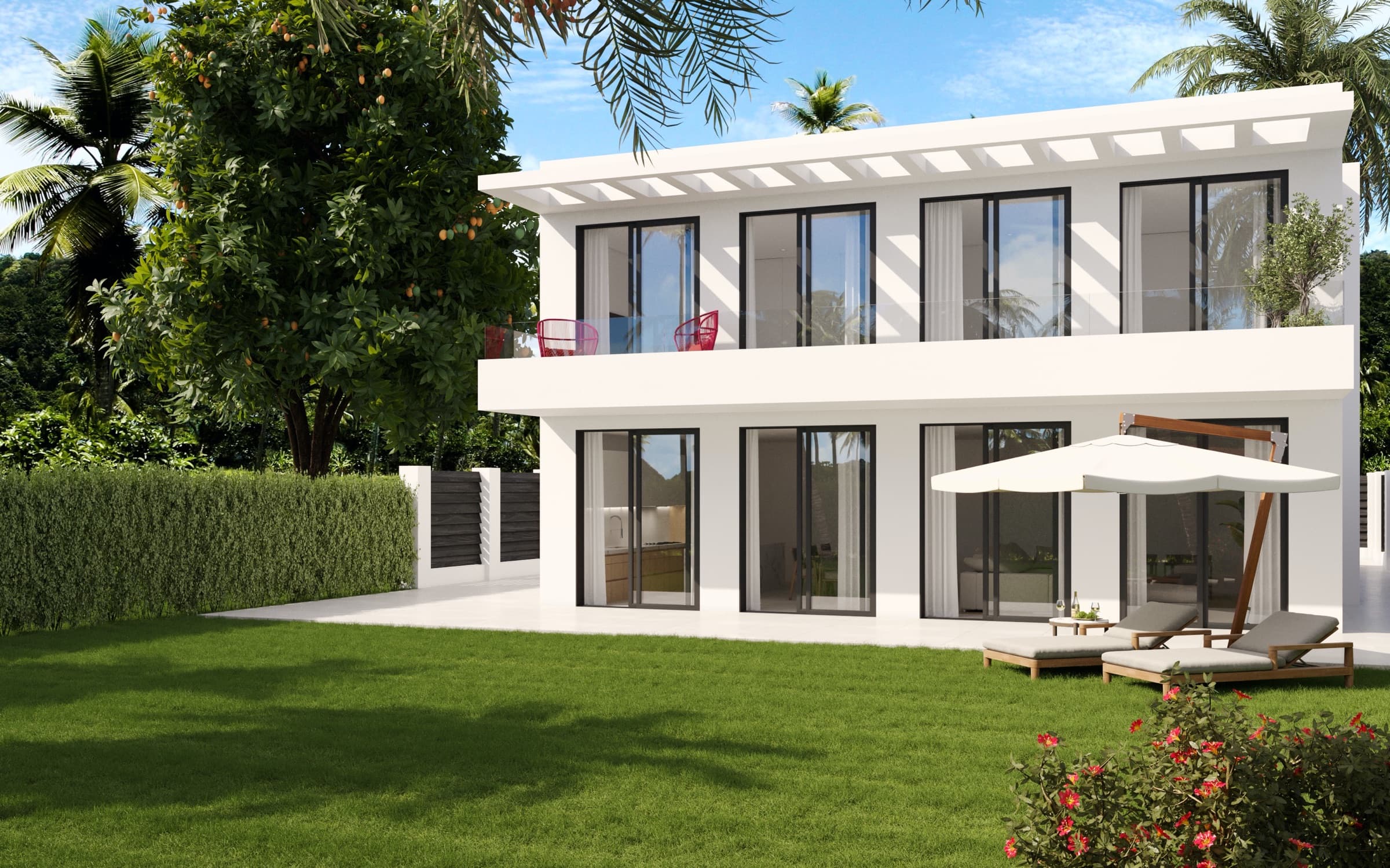 The Aura seen from its own landscaped garden, with terrace and sun loungers